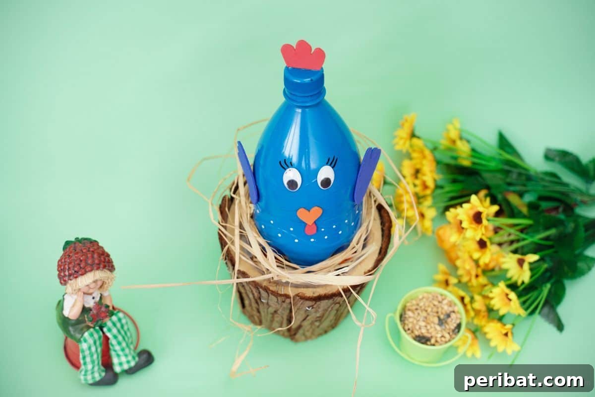 Blue plastic bottle turkey craft in front of a green leafy background.