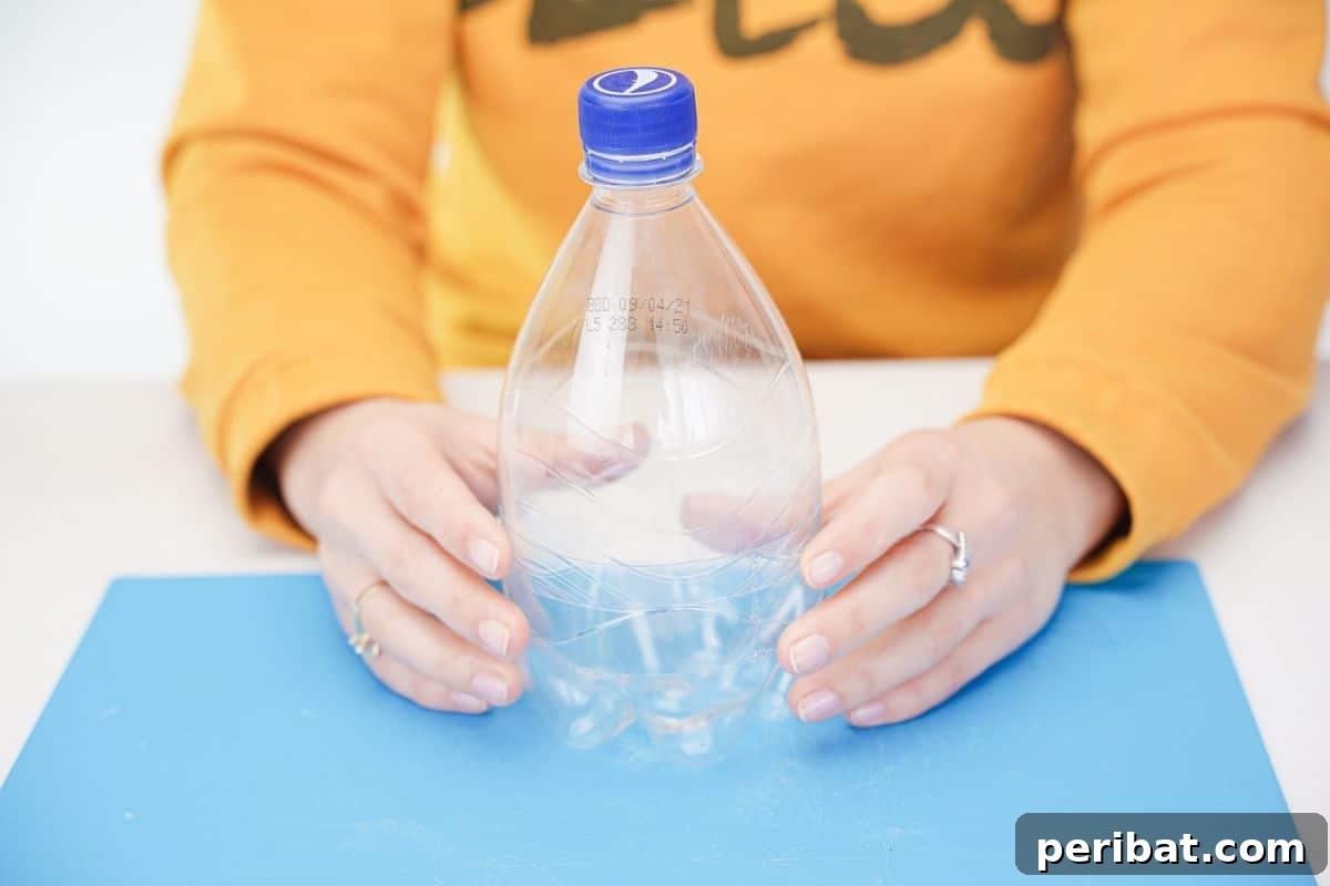 Two bottle halves held securely together on a blue mat, forming the turkey's body.