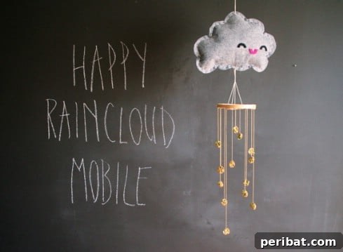 Irresistible DIY Baby Crafts for Your Bundle of Joy 12 DIY Happy Raincloud Mobile for Nursery