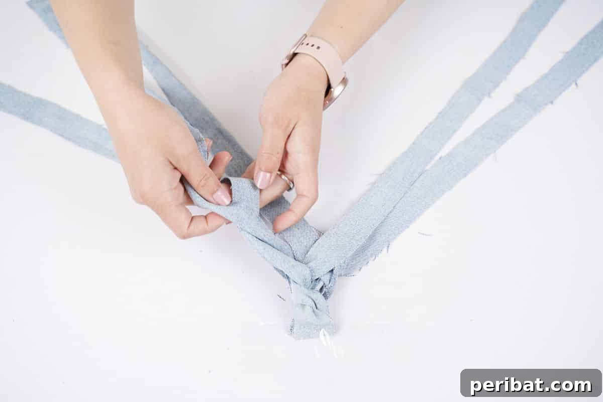 Denim Reimagined: Braided Headband DIY 12 Hands beginning to braid denim strips