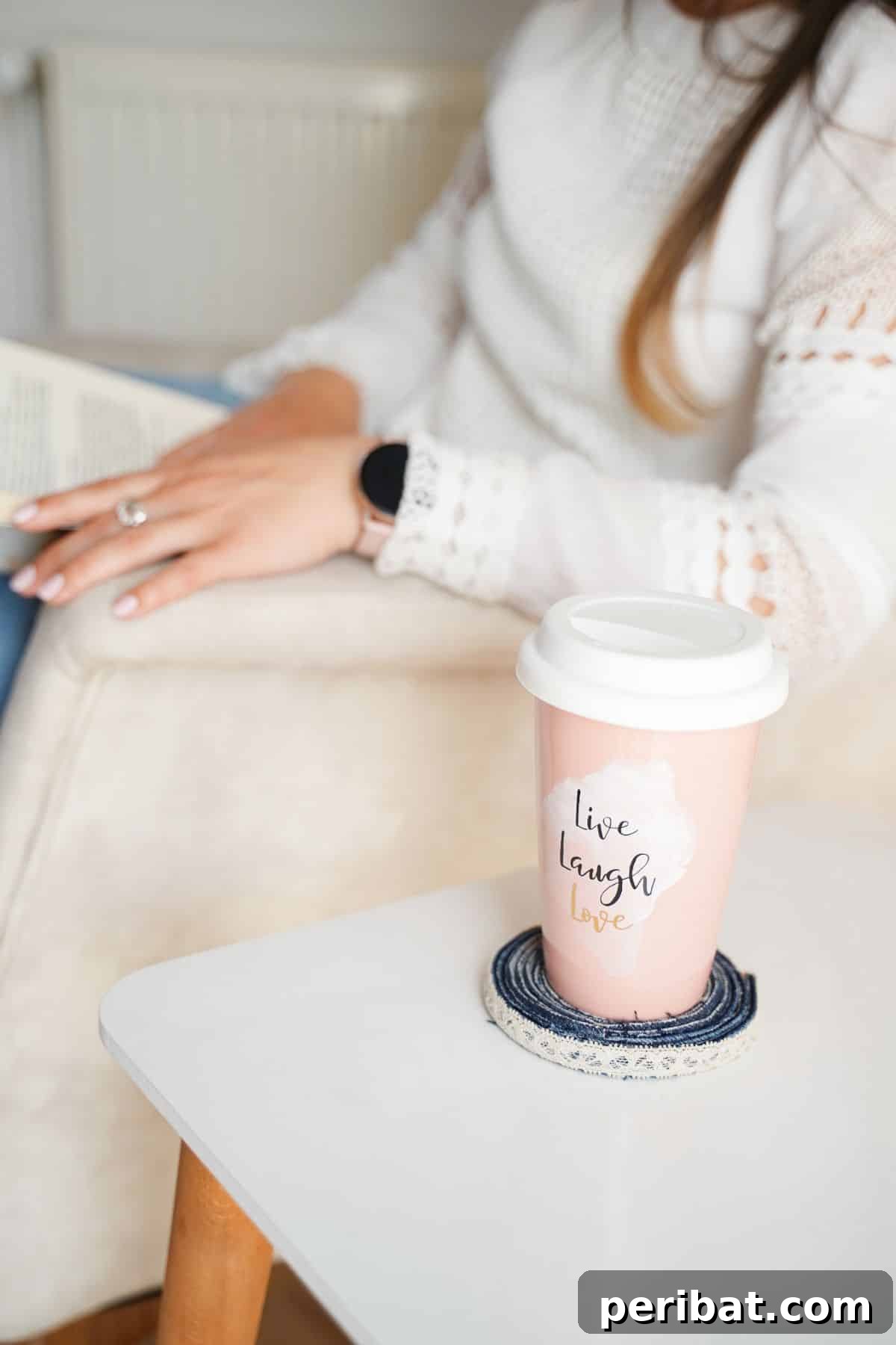 Simple Denim Coaster Upcycle Project 13 pink and white travel mug on top of denim coaster on white side table