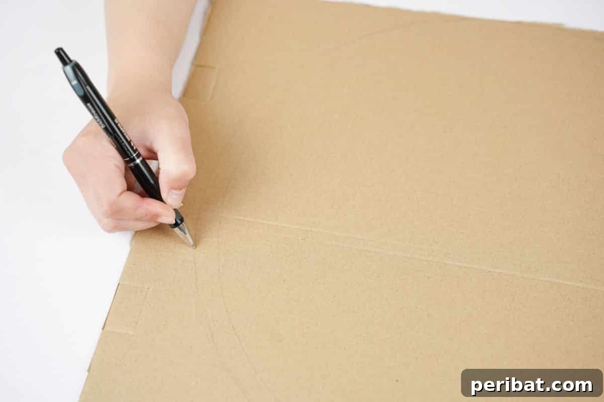 Close-up of a hand drawing a circle on cardboard with a pen, preparing the base for the placemat, with measurements visible.