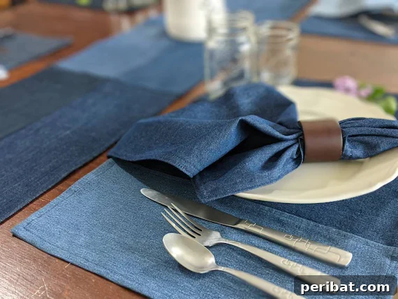 A close-up shot of a woven denim placemat with a white bowl on top, showcasing its functionality and stylish texture.