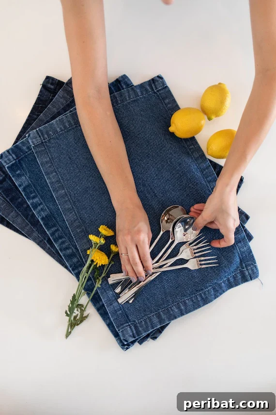 A beautifully set table with multiple denim placemats, demonstrating a complete dining setup for guests.