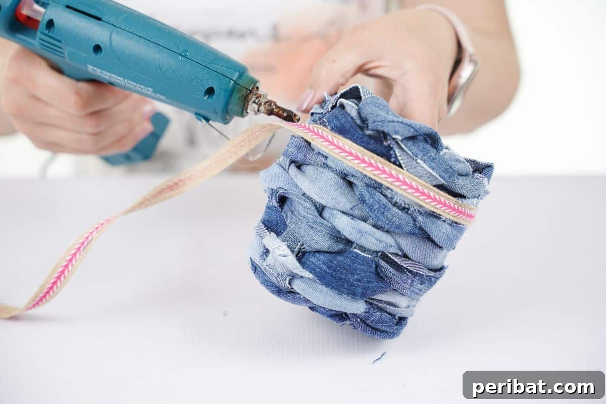 Rustic Denim Planter Basket 17 pink ribbon being glued to side of denim basket
