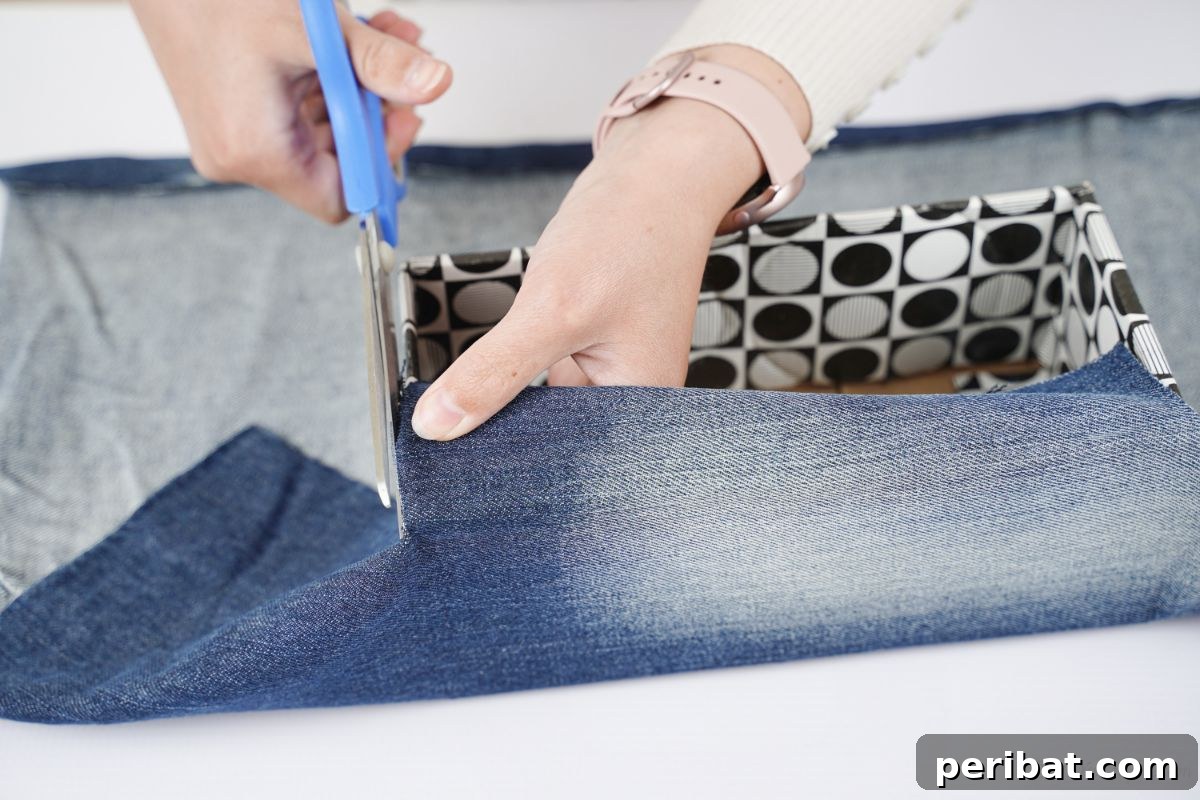 Upcycled Denim Storage Box 4 blue scissors trimming excess denim around box