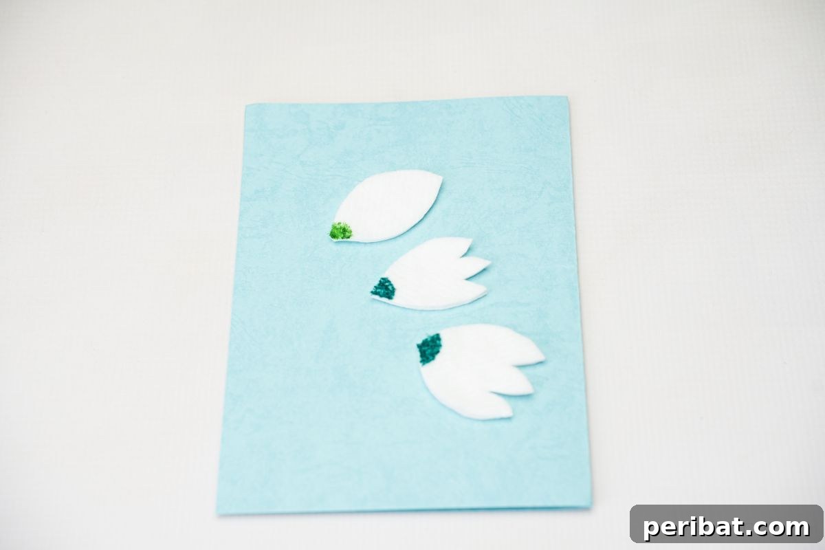 paper tulips on blue card