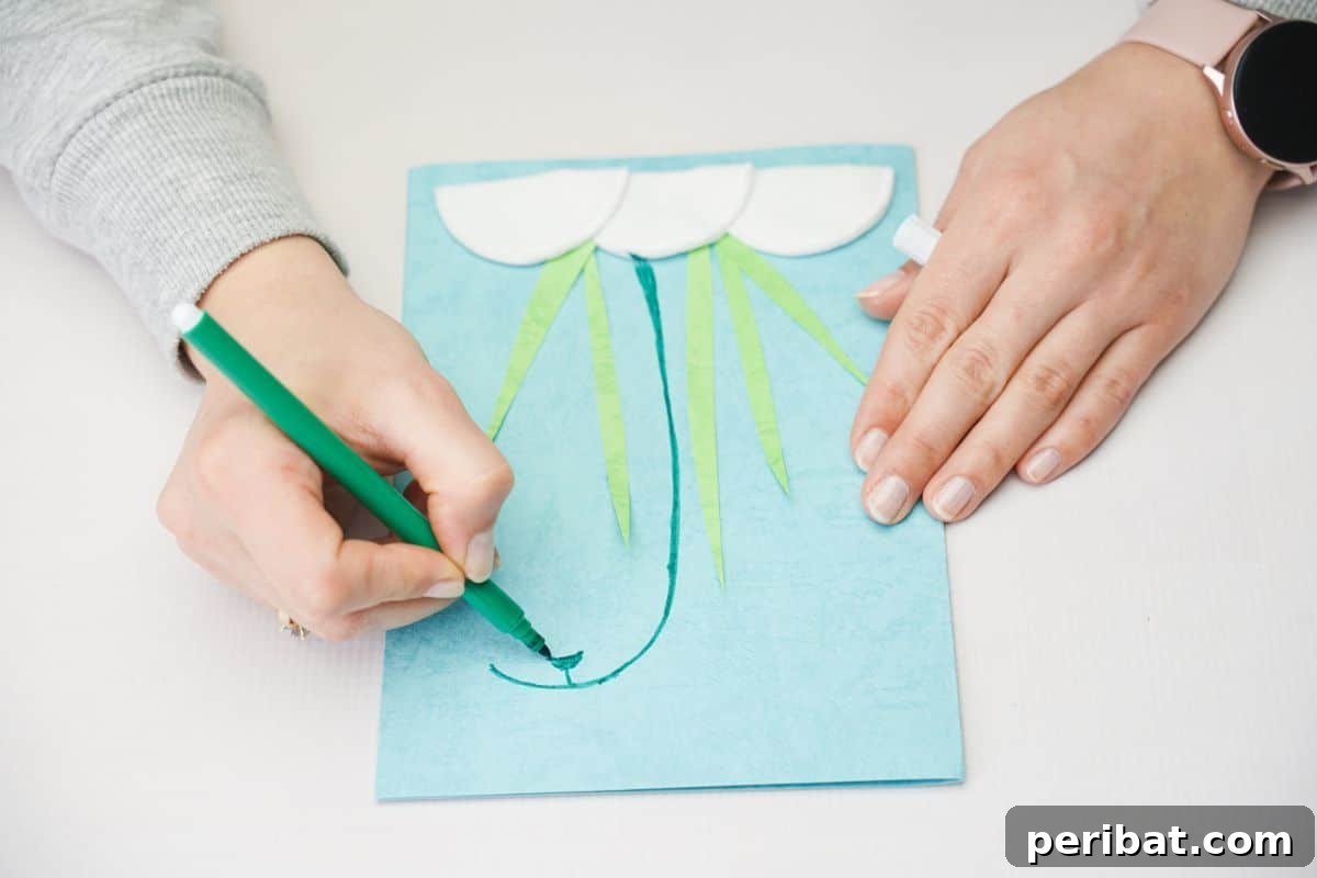 hand drawing stem with green marker onto front of card