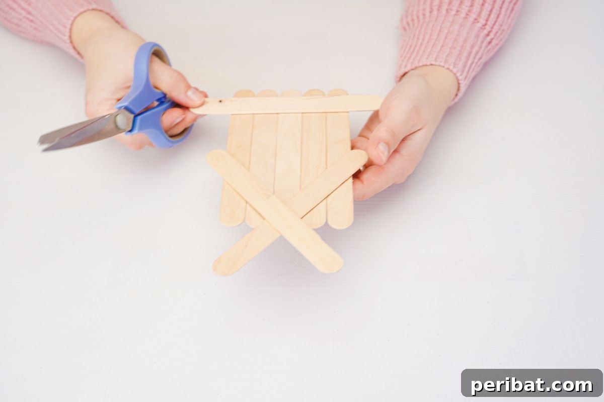 DIY Popsicle Stick Farmhouse Decor 3 scissors being used to trim craft stick edges