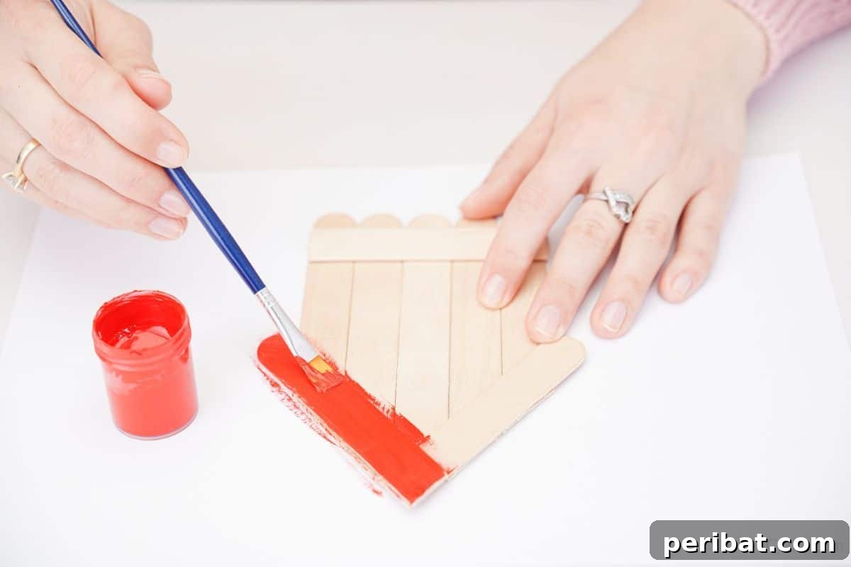 DIY Popsicle Stick Farmhouse Decor 4 orange paint on craft stick house