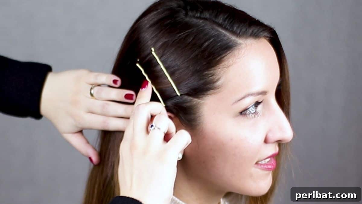 Braided Bobby Pin Glam 9 a bobby pin being pushed into side of bobby pin hairstyle