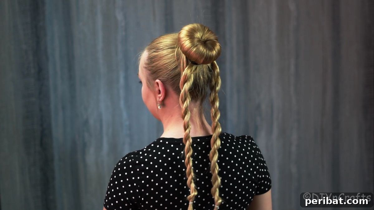 Stunning Braided Donut Bun Updo 12 Two twisted braids hanging from the base of the hair donut bun.