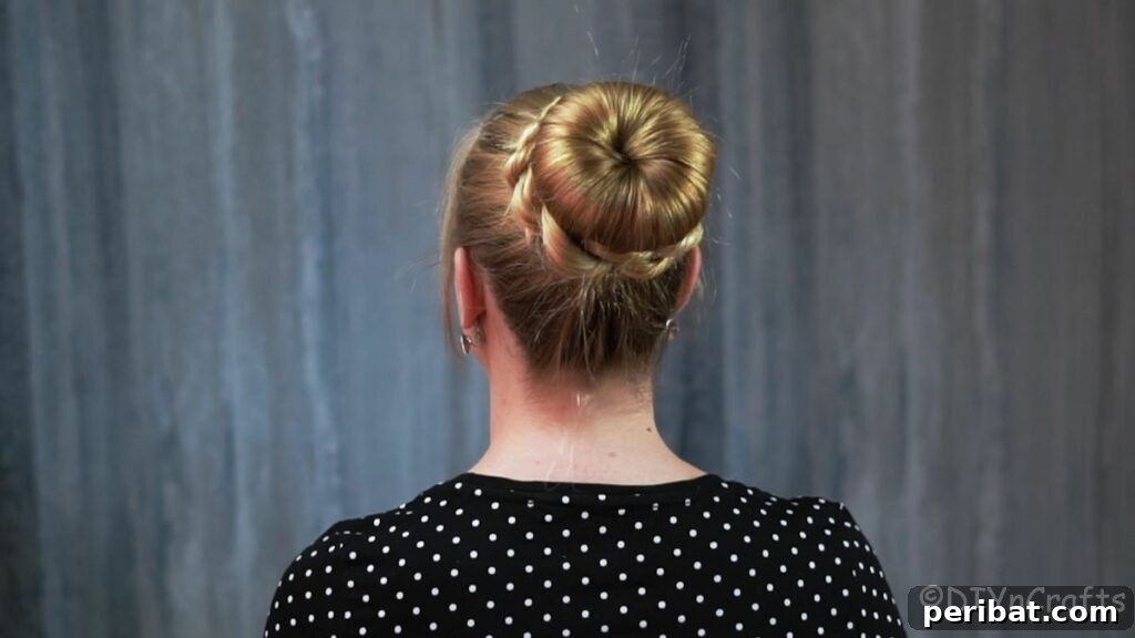 Stunning Braided Donut Bun Updo 16 Back view of an elegant braided bun created using a hair donut.