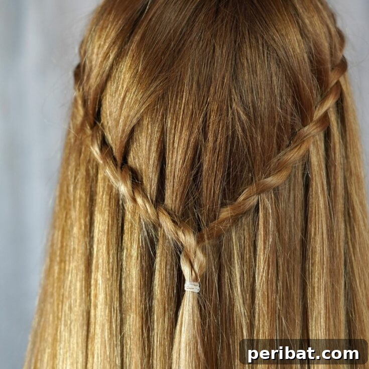 waterfall braid on back of blonde head