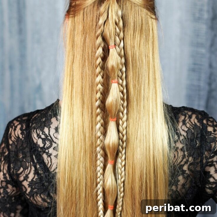 Charming Half-Up Viking Braids 2 Woman showcasing a half-up Viking style braided hairstyle with blonde hair.