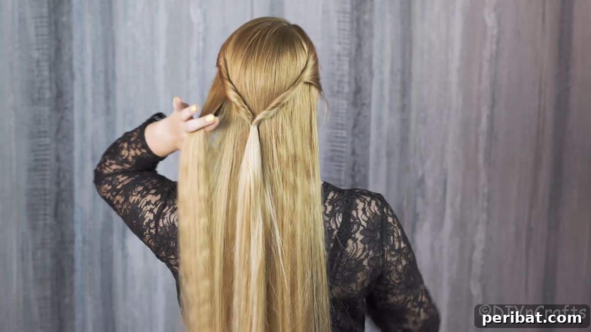Artfully Twisted Low Braided Ponytail 8 Dividing remaining hair into sections for the low ponytail braid