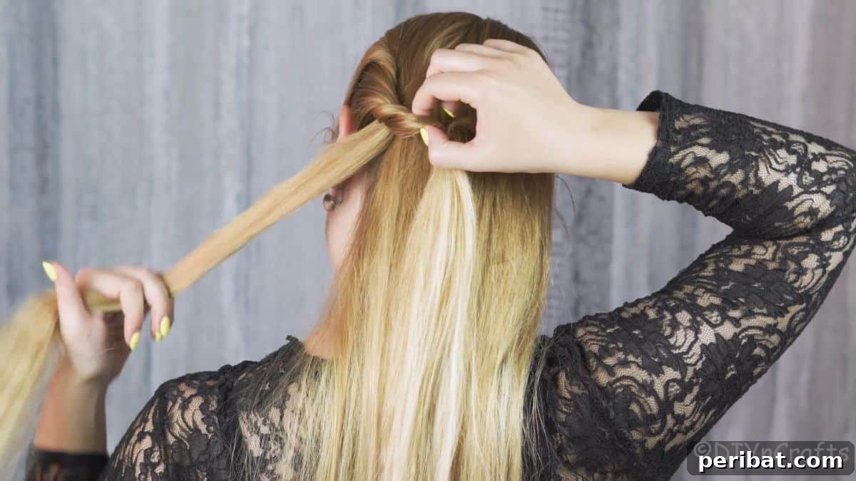 Artfully Twisted Low Braided Ponytail 9 Pulling hair over the side twist