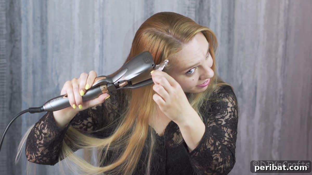 Aluminum Foil Curls Made Easy 6 A hair straightener is gently clamping down on an aluminum foil packet containing a rolled section of hair, applying heat to set the curl efficiently and safely.