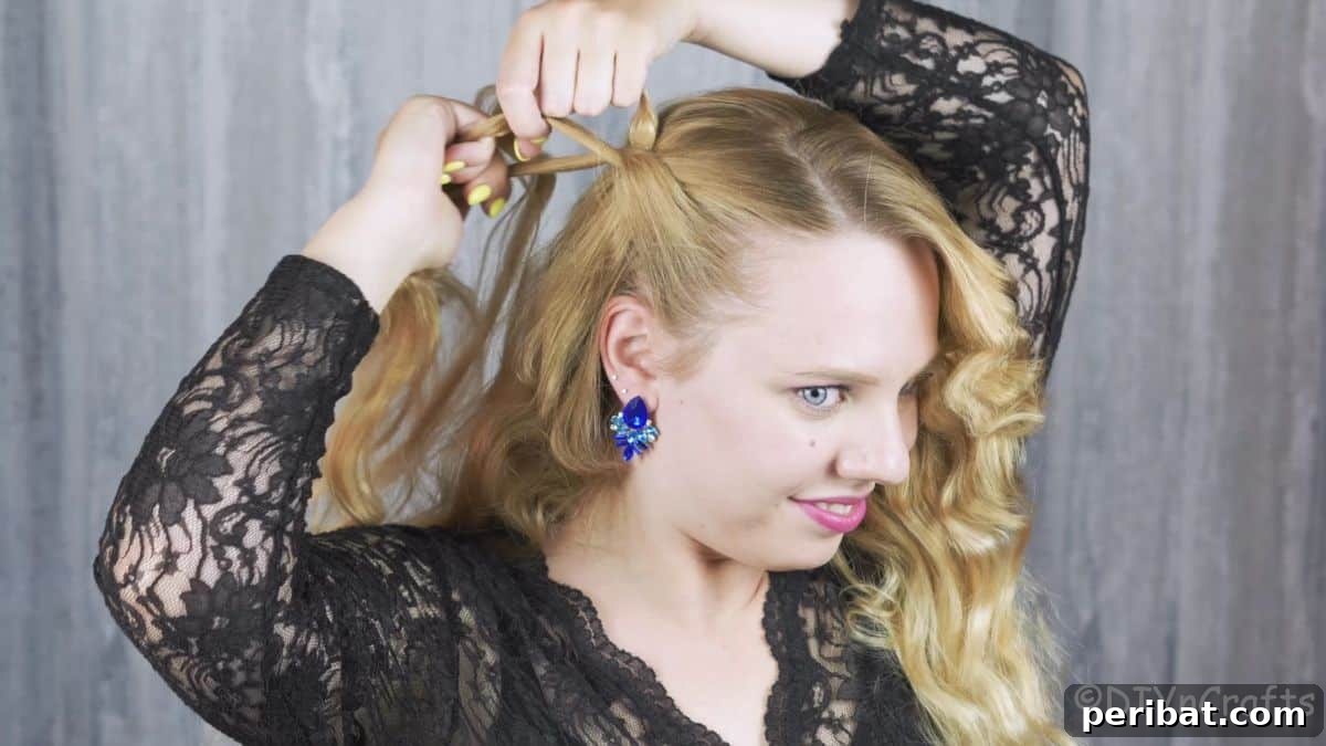 Chic Braided Halo Half-Up 15 braided hair being pulled back on head