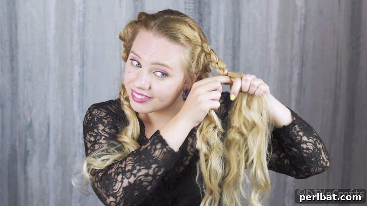 Chic Braided Halo Half-Up 16 woman in black shirt braiding part of her hair