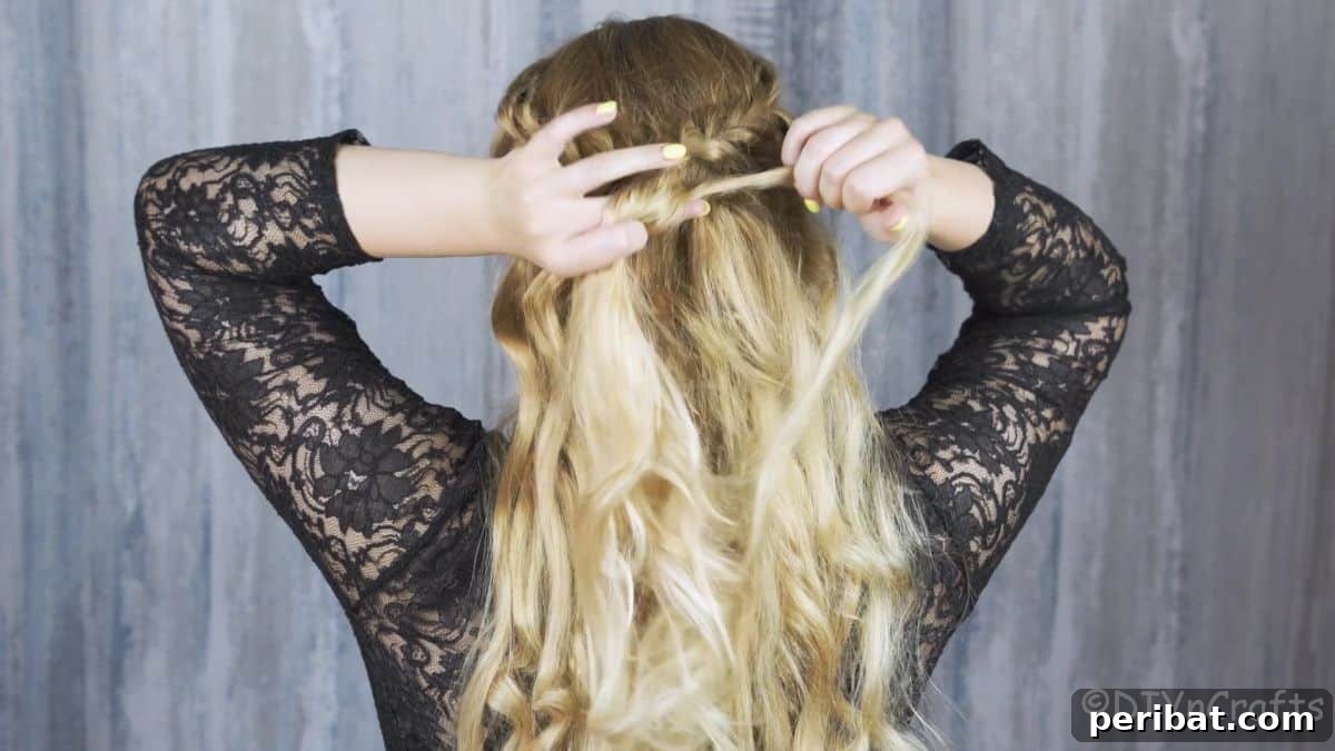 woman twisting back of hair on braided crown