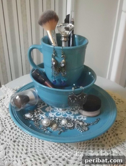Multi-tiered makeup stand created from stacked plates, bowls, and teacups
