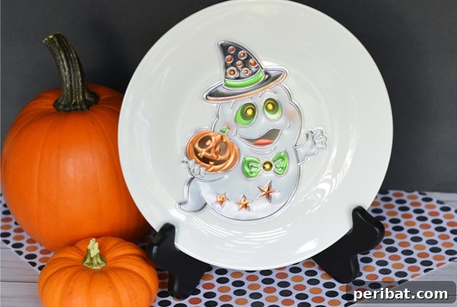 A festive Halloween plate displayed on a black stand, showcasing a simple yet effective decoration idea.