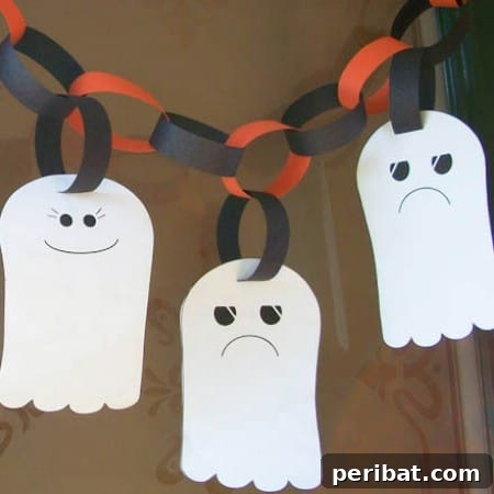 A charming ghost garland made from cut-out paper ghosts strung together, perfect for festive Halloween decor.