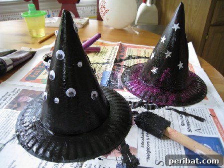 A festive witch hat, adorned with glitter and colorful ribbons, ready for Halloween decorations or costume wear.