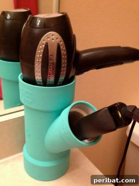 85 Genius Home Organization and Storage Hacks for Every Space 48 Hairdryer stored neatly in a PVC pipe attached inside a cabinet