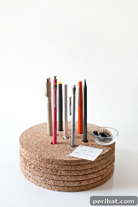 85 Genius Home Organization and Storage Hacks for Every Space 55 Pens stored upright in stacked cork trivets with drilled holes