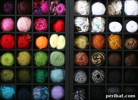 85 Genius Home Organization and Storage Hacks for Every Space 63 Wine rack used to store individual yarn spools