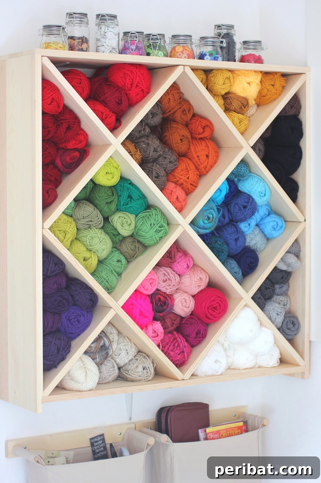 85 Genius Home Organization and Storage Hacks for Every Space 64 Yarn holder made from a wine rack, organizing spools by color