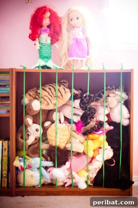 85 Genius Home Organization and Storage Hacks for Every Space 79 Bungee cords used vertically to store plush animals