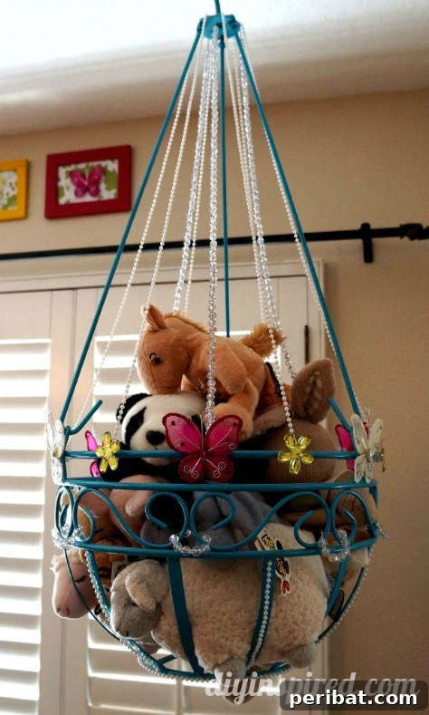 85 Genius Home Organization and Storage Hacks for Every Space 81 Repurposed plant hanger painted and decorated, holding stuffed animals