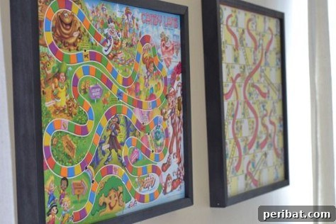 85 Genius Home Organization and Storage Hacks for Every Space 82 Game board with game pieces stored in a plastic bag attached to the back, framed for wall art