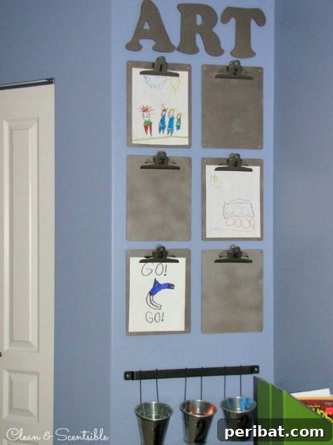 85 Genius Home Organization and Storage Hacks for Every Space 87 Children's artwork displayed on clipboards arranged on a wall