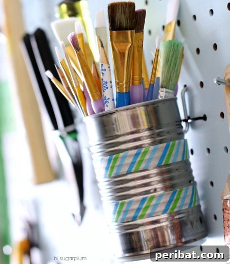 85 Genius Home Organization and Storage Hacks for Every Space 90 Decorated tin cans mounted on a pegboard for tool storage