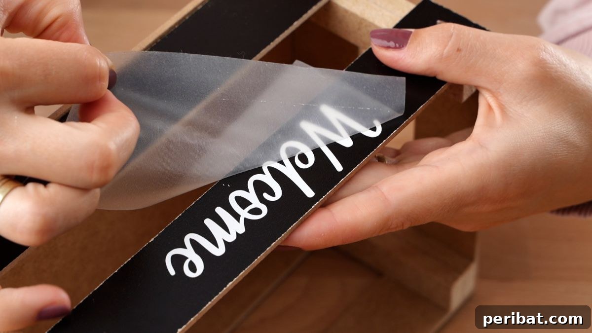 Create Custom Address Signs with Your Cricut 15 peeling transfer tape off of welcome message to basket