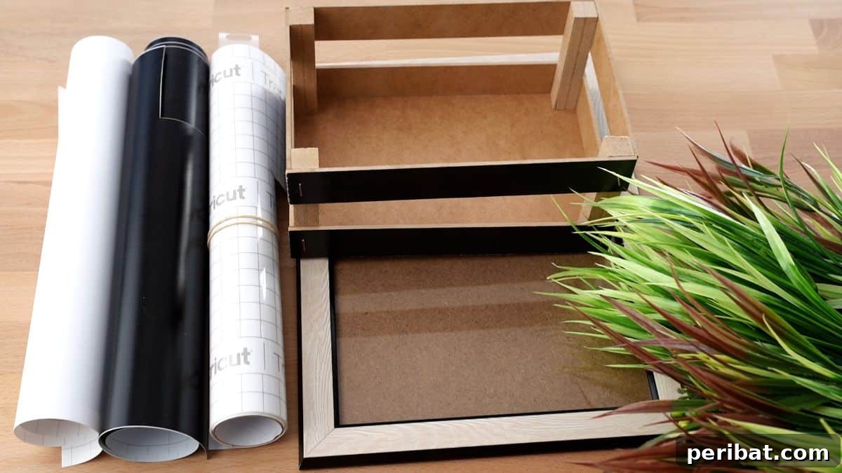Create Custom Address Signs with Your Cricut 4 basket, frame, vinyl, and fake greenery on wood table