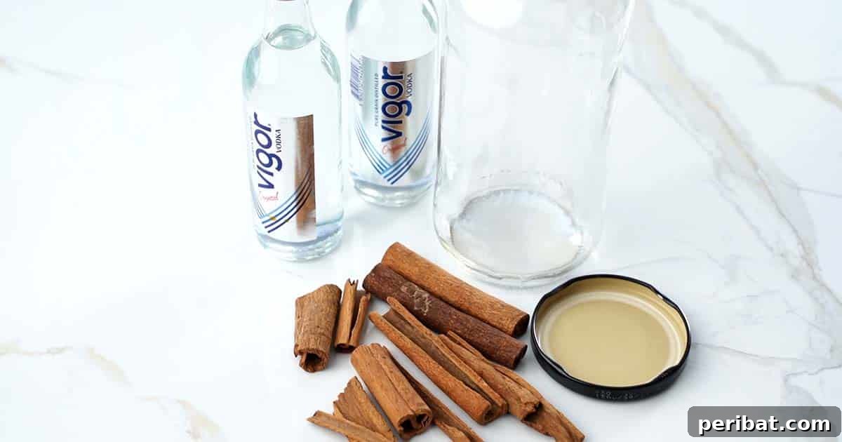 Mastering Homemade Cinnamon Extract 4 Collection of supplies including cinnamon sticks, vodka, and an empty jar for making homemade cinnamon extract.