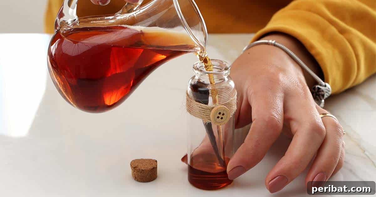 Mastering Homemade Cinnamon Extract 8 Pouring homemade cinnamon extract into a small decorative bottle, ready to be gifted.