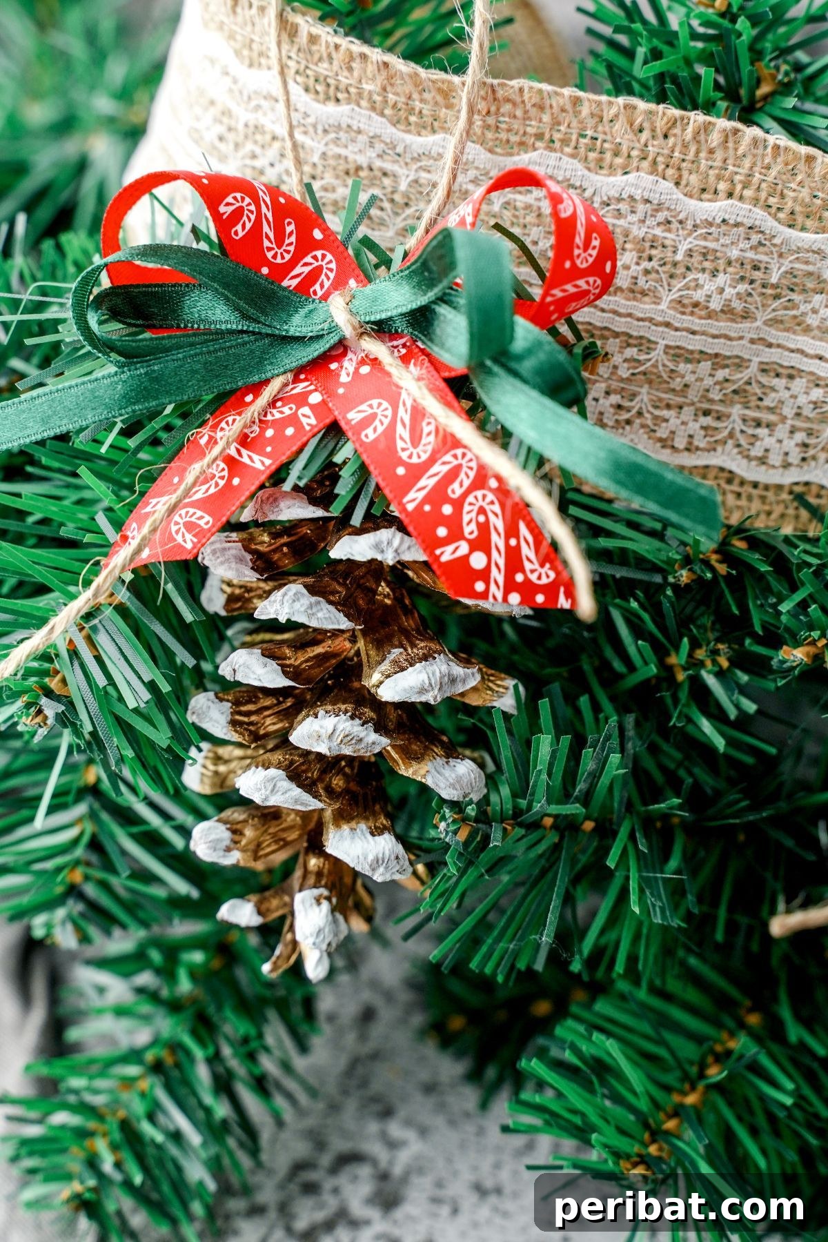DIY Pinecone Christmas Ornaments 2 Burlap lace on fake tree with a rustic pinecone ornament hanging