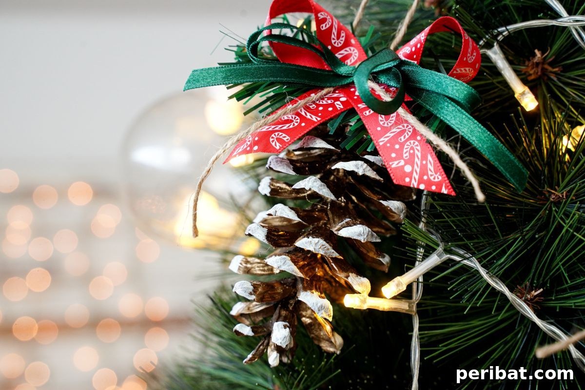DIY Pinecone Christmas Ornaments 17 An assortment of natural pinecones, some painted gold and frosted with white, along with ribbons and crafting supplies, embodying festive decoration