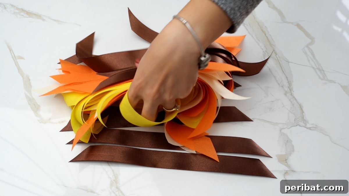 Autumn Farmhouse Wreath from Upcycled Fabric Scraps 21 A stacked collection of colorful fall-themed ribbons and fabric pieces neatly arranged on a sophisticated marble table.