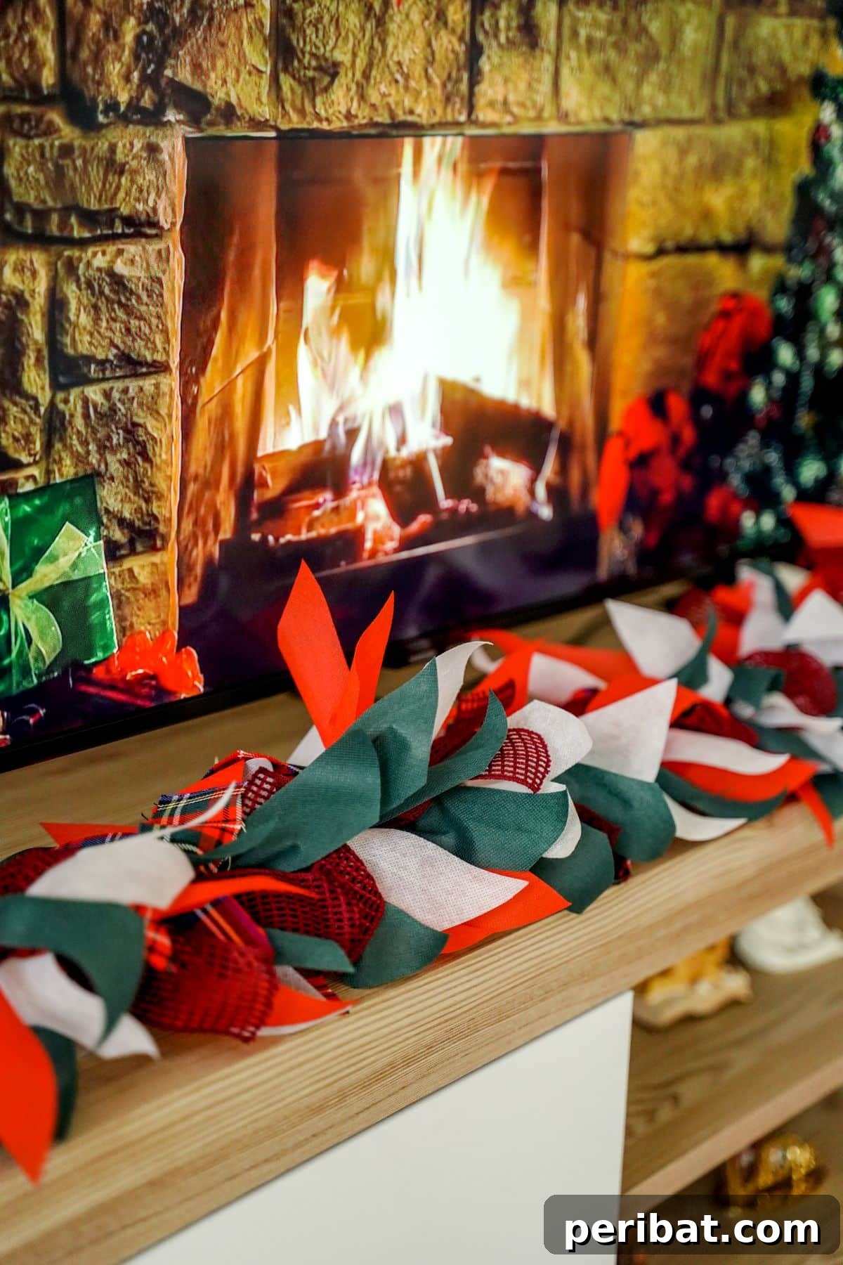 Handcrafted Rustic Christmas Rag Garland 11 Christmas garland in front of fireplace