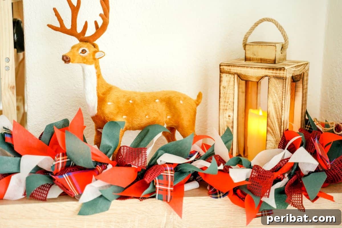 Handcrafted Rustic Christmas Rag Garland 15 Fake deer and lantern on shelf with colorful Christmas rag garland in front