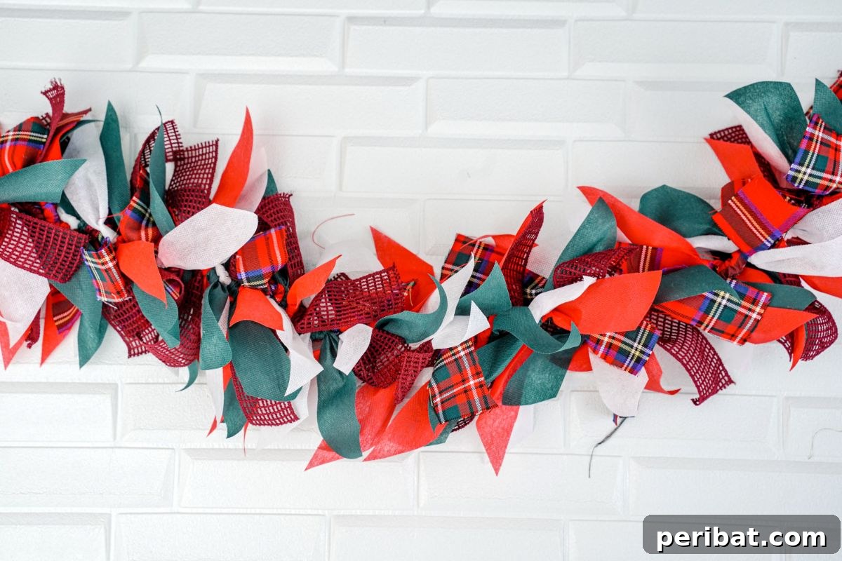 Handcrafted Rustic Christmas Rag Garland 3 Christmas garland hanging on white wall