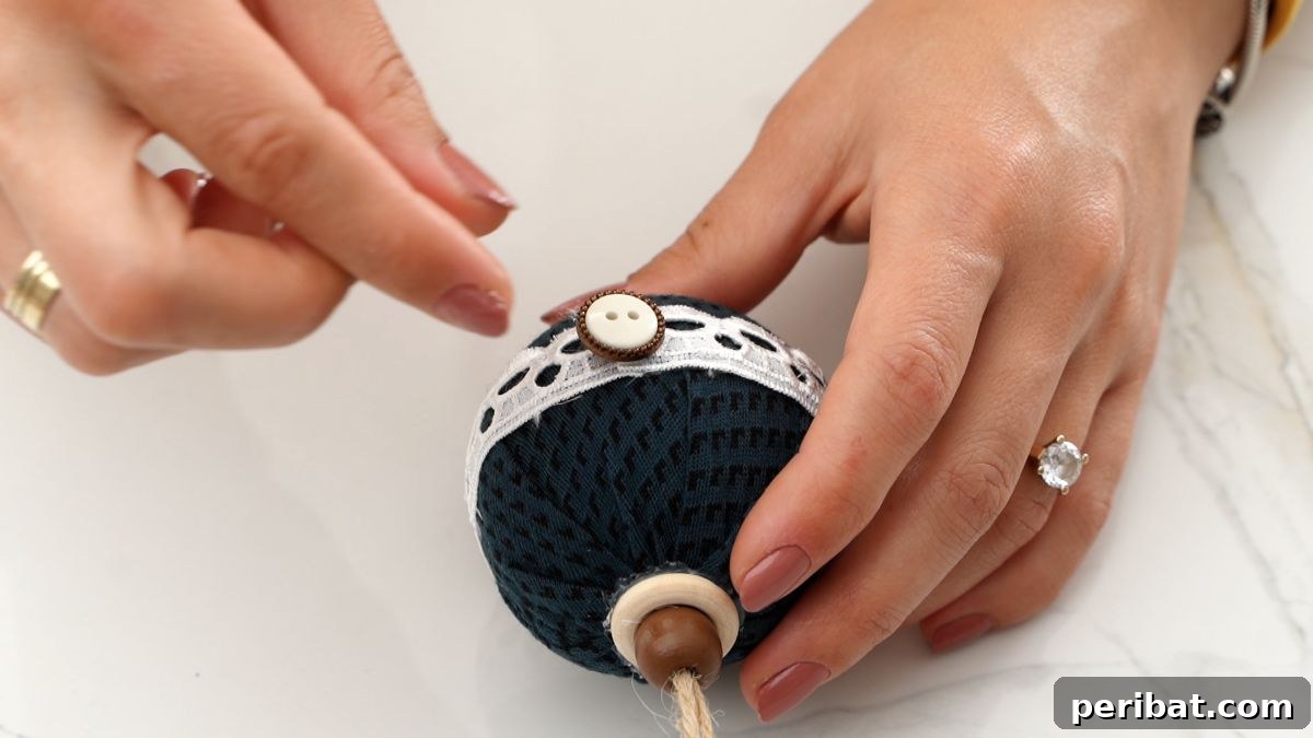 Chic Fabric Holiday Bauble 21 gluing button on ornament