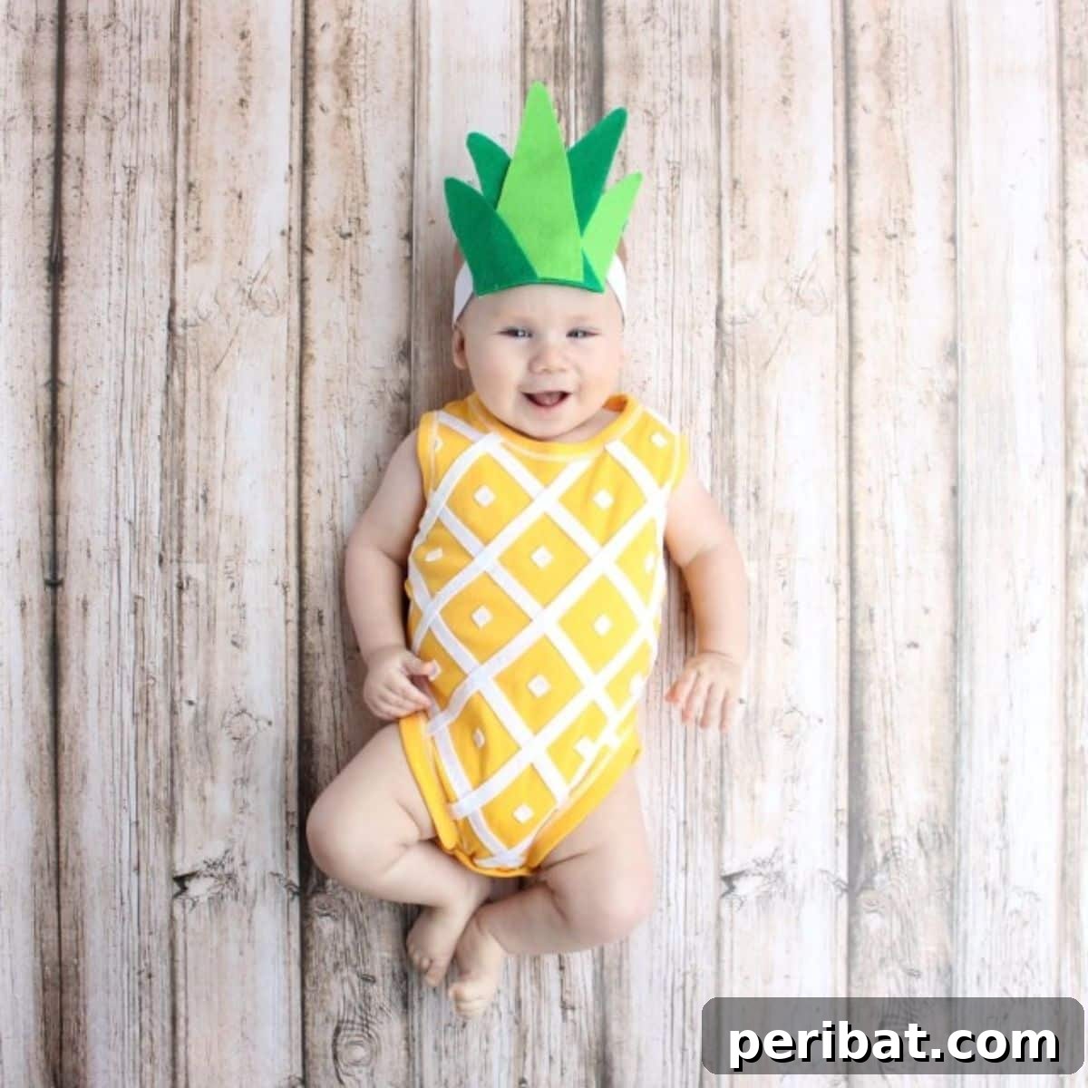 Spooktacularly Adorable DIY Baby Halloween Costume Ideas 15 A cheerful Pineapple baby costume, featuring a yellow onesie with felt 'spikes' and a green leafy crown. This no-sew DIY Halloween outfit is sweet, simple, and appealing.